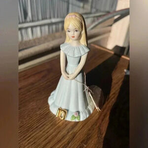 Porcelain doll figurine growing up brand age 10